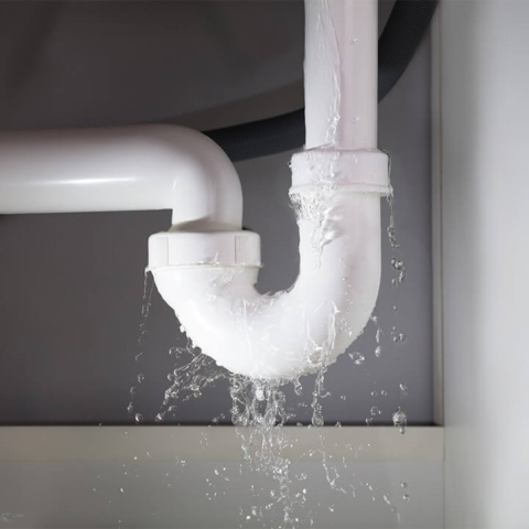 PVC pipes under sink with a fast and heavy leak