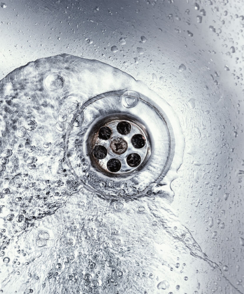 Water flowing into a sink drain