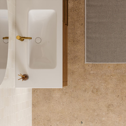 A modern bathroom floor where unusual warm spots can indicate a hidden hot water slab leak requiring professional plumbing inspection.